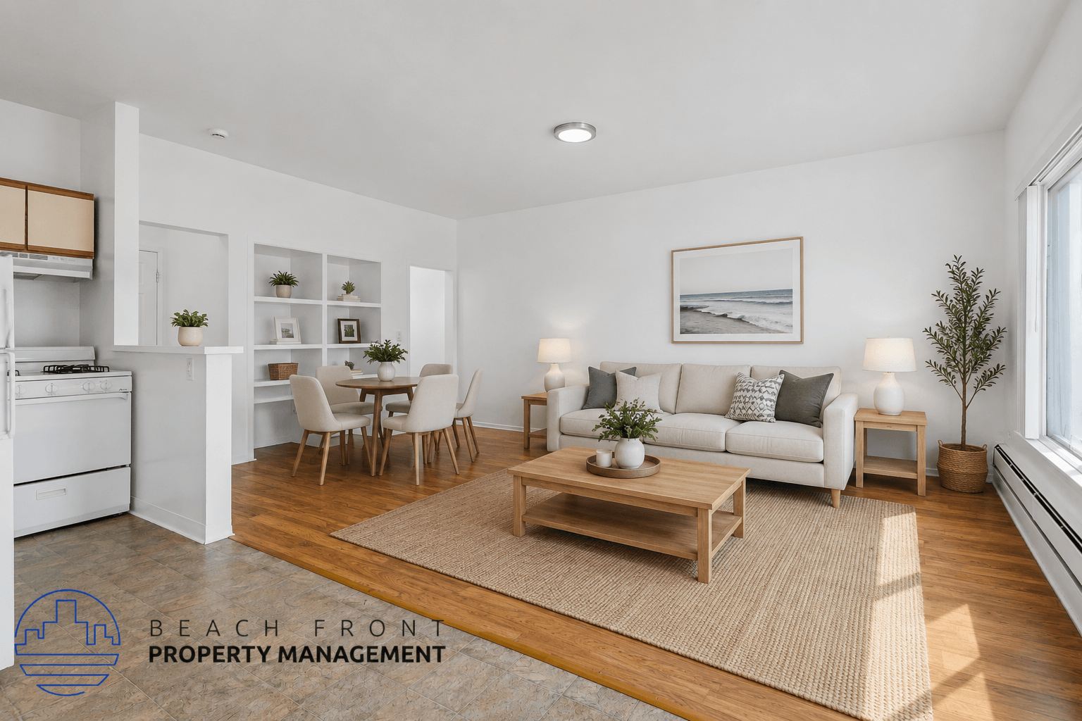A well-lit living room with a dining area and kitchen in the background.